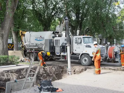 people fixing water pipes